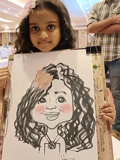 A young girl with curly hair and a flower, very happy with her portrait. Capturing these details is what makes each drawing special.