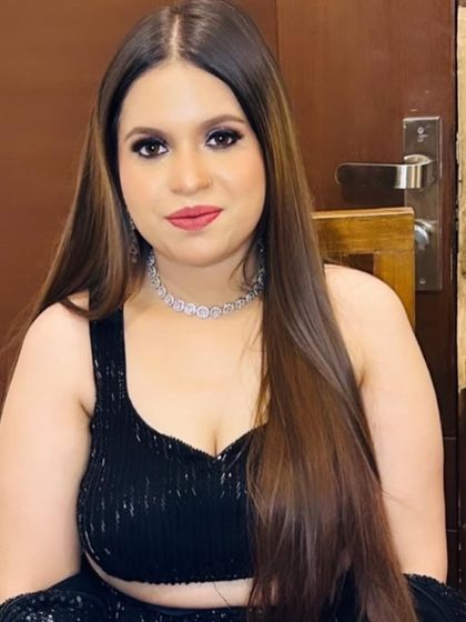 A chic and modern party look with a black sequined lehenga and a diamond choker.