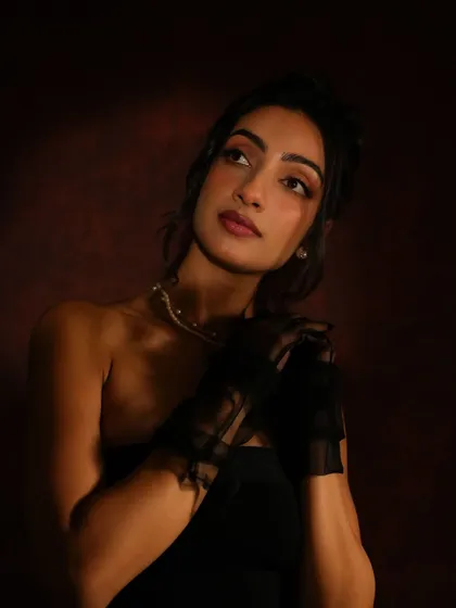 A beautiful portrait with a focus on the eyes. The soft, upward gaze is enhanced by the clean eyeliner and defined lashes.