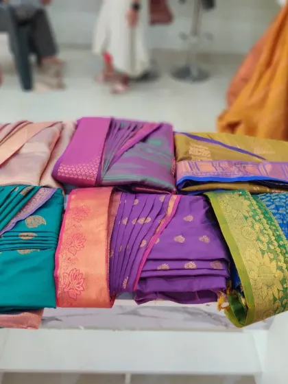 A glimpse of the beautiful sarees I get to work on every day. I handle all types of fabrics, from heavy Kanjeevarams to lightweight georgettes, ensuring each one is pleated with the utmost care.