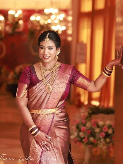 Dressed for her brother's wedding, this client embodies South Indian elegance. I focused on a flawless base that enhances her skin tone, defined eyes, and styled her in a traditional Kanjeevaram saree, completing a sophisticated and authentic look.