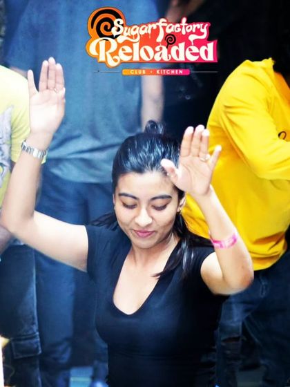 A shot of a dancer lost in the music, used as part of the promotional material for my throwback night at Sugar Factory.