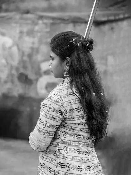 The black and white version of the profile shot, adding a classic and timeless feel.