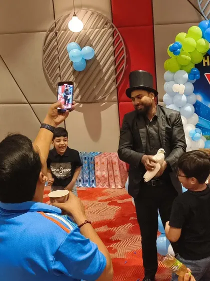 Party activities are just as important as the decor. This cricket-themed party included a magic show that captivated the children, with the magician even producing a live dove.