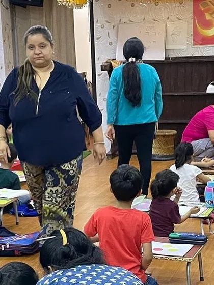 A glimpse of me overseeing the class. I am always moving around the room, checking on progress and offering encouragement.