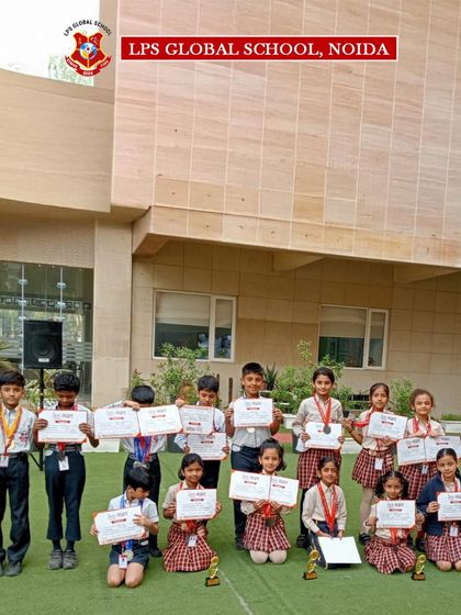 The victorious gymnastics team poses with their coach and the Principal. We celebrate every achievement together as a school community, reinforcing the spirit of teamwork and collective pride.