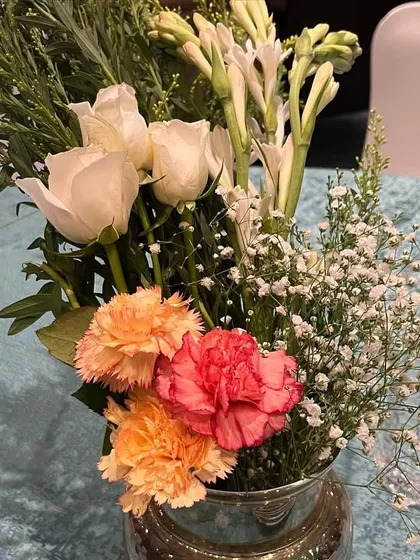 A simple yet elegant floral centerpiece for the anniversary celebration. I believe the small details are just as important as the grand gestures.