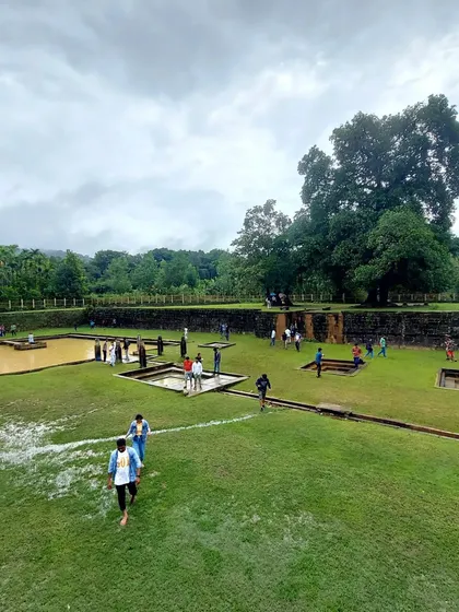 Exploring the historic Nagara Fort, with its green lawns and ancient walls. This is one of the many sights included in our Kodachadri trip.