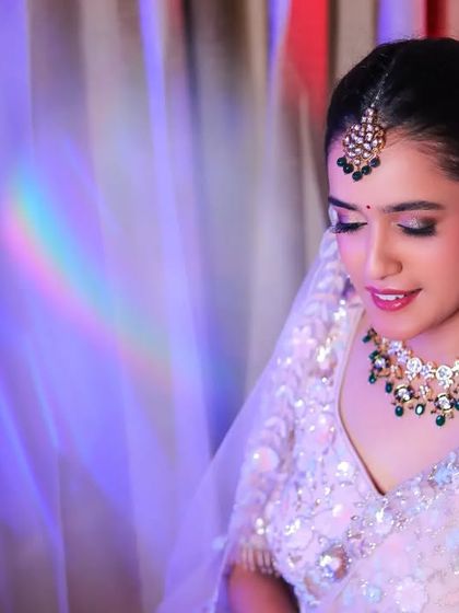 A beautiful portrait of a bride, with a rainbow light flare adding a touch of magic.