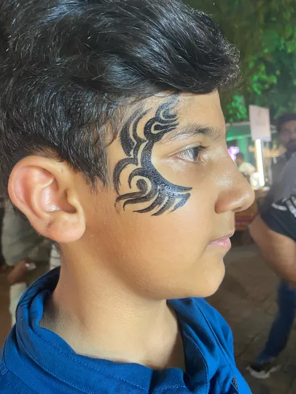A black tribal design for this young man. It's a timeless and cool look.
