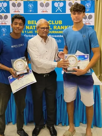 Wyatt O'Brien receives his AITA 1 Lac Men's Doubles winner's trophy in Jamshedpur, following a straight-sets victory in the final.