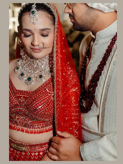 A quiet moment of reflection. The soft light and close crop create an intimate portrait, highlighting the stunning details of her diamond and emerald jewelry.