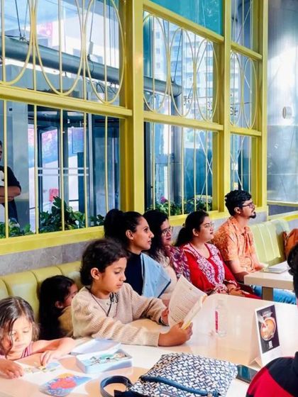 The audience, including children, enjoying the poetry session at the Sheraton. Our events are designed to be inclusive for all ages.