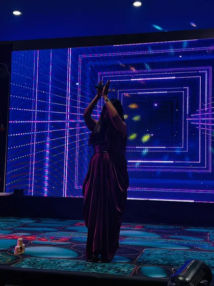 A shot from behind, showing me getting the audience hyped up for a performance at the Diwali event.