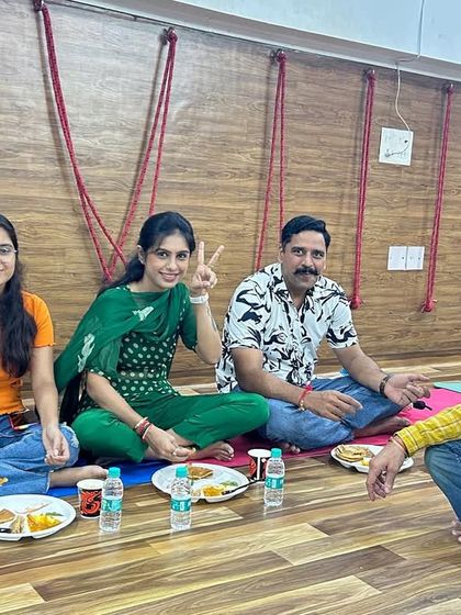 Enjoying a community meal (bhandara) together. Sharing food and conversation is how we strengthen the bonds of our Kula.