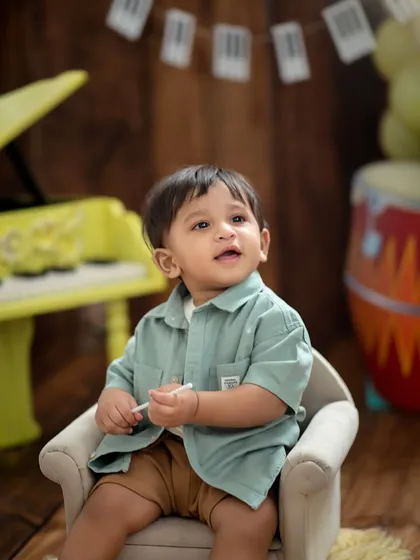 Looking up in wonder. We capture those moments of curiosity that show your child's personality during their milestone photoshoot.