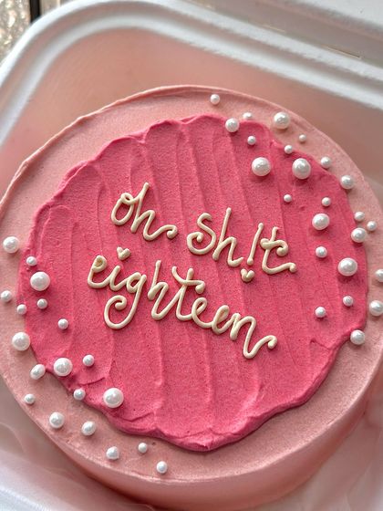 A closer look at the 'oh sh!t eighteen' bento cake, showing the textured pink frosting and scattered pearls.