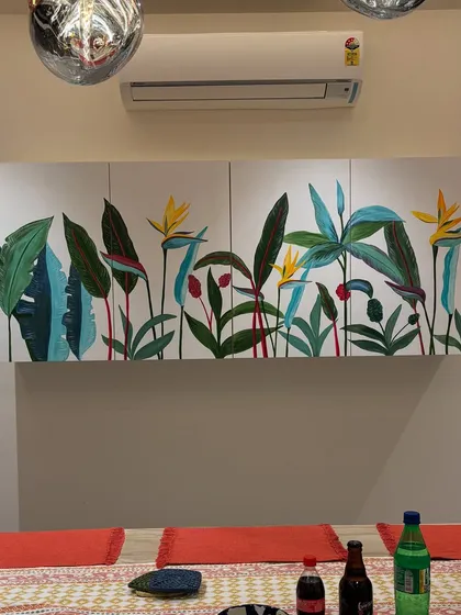 I love how a splash of color can completely transform a piece of furniture. This plain crockery unit in a Bangalore home became a vibrant canvas for a custom tropical mural, bringing the client's love for nature right into their dining space.