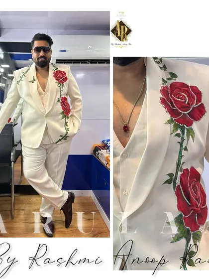 For this client, we wanted to tell a story of romance. I took a classic white three-piece suit and turned it into a canvas, hand-painting bold red roses that climb up the lapel. This is a great example of how we can take a simple idea and create something truly unique and personal for your big day.