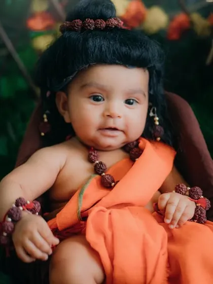 This little one's expression is full of innocence and grace. A beautiful portrait for Ram Navami.