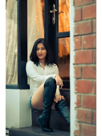Using a doorway to frame the shot adds depth and composition. The combination of the brick wall, the warm interior light, and the cool outdoor tones creates a beautiful balance.