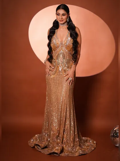 A full-length shot showing Tanishaa owning the look. The combination of the dress, hair, and makeup creates the ultimate glamorous, show-stopping effect.