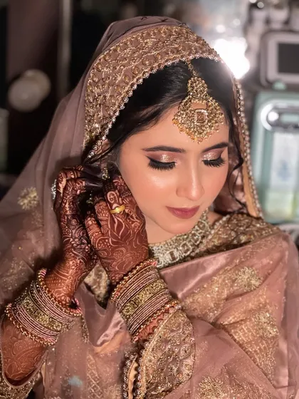 A close-up on the soft, pink-toned eye makeup.