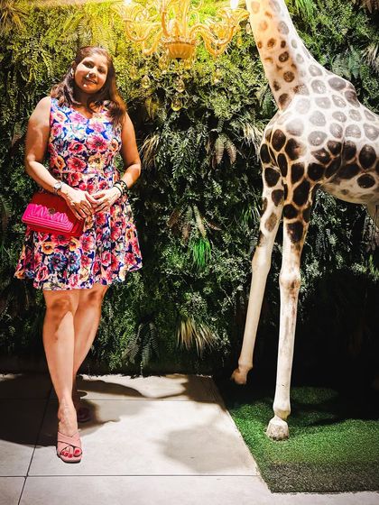 For a special anniversary celebration, I chose this vibrant floral print dress. The bright colors and flattering A-line cut make it a fun and festive choice for any happy occasion.