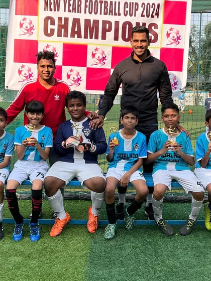 Our U-11 team proudly showing off their trophies from the New Year Cup.