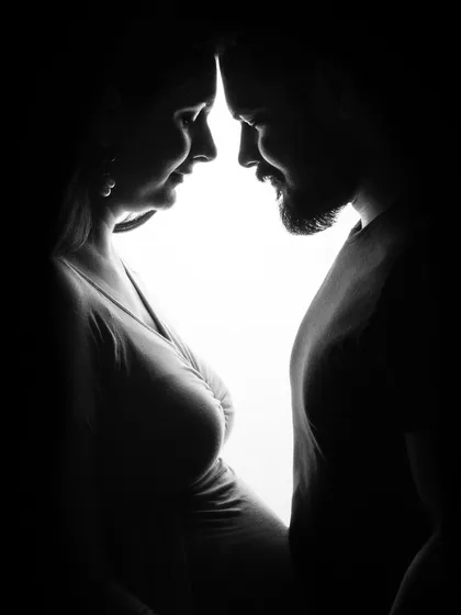 An anticipation of love. This intimate silhouette of a couple, their faces close, is a powerful and artistic representation of their connection.