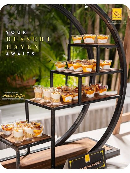 Your dessert haven awaits. This stylish, multi-tiered stand displays our Gajar Halwa Parfaits, offering a modern presentation for a classic dessert.