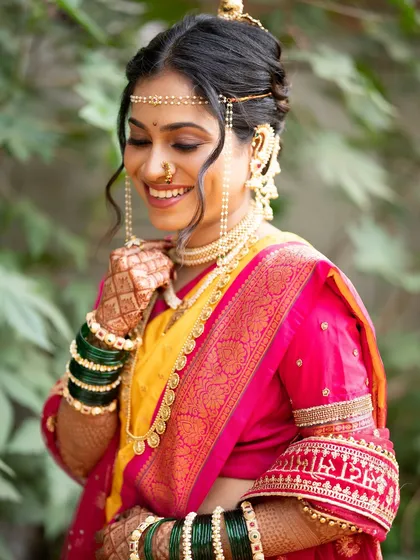 The complete look, showcasing the beautiful nauvari saree and the traditional khopa hairstyle. My goal is to create a cohesive and elegant bridal appearance from head to toe.