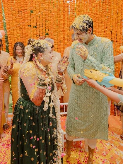Who said Haldi has to be traditional? We brought in pichkaris for a fun-filled flower water fight, adding an element of playful chaos that perfectly matched the couple's energy.