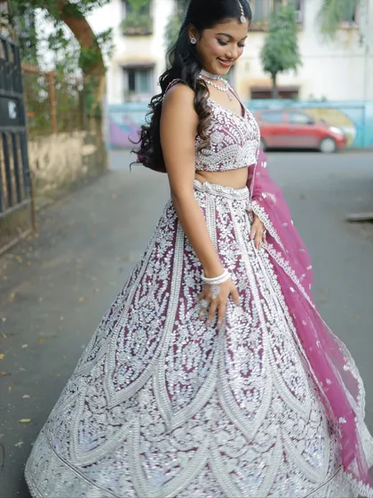 The detailed embroidery on this lehenga is just stunning. The contrast between the deep wine fabric and the silver work is so rich.
