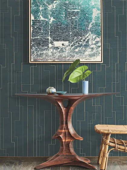 Our wallcoverings go beyond aesthetics, offering a unique blend of texture and design. This linear geometric pattern in deep teal with metallic accents adds a touch of art deco sophistication to this entryway.