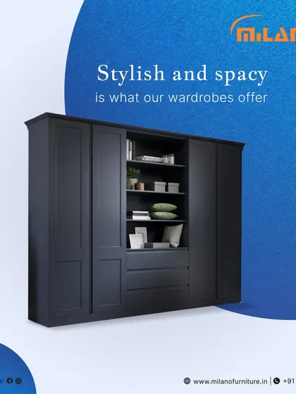This stylish and spacious dark blue wardrobe offers ample storage. The design includes open shelving in the center for display, combining functionality with aesthetic appeal.