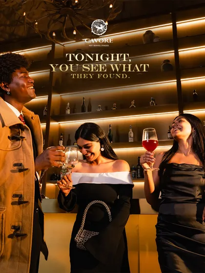 Here, conversations flow as smoothly as the wine. This moment captures the essence of our social scene: sophisticated, effortless, and alive with connection against the warm glow of our backlit bar.