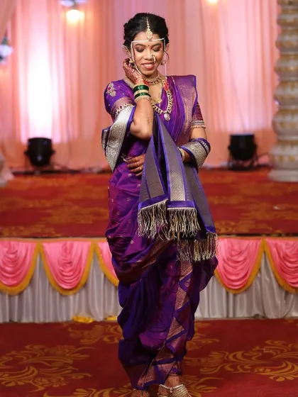 A candid moment on stage. The makeup and hair are designed to look stunning from a distance and under stage lighting.