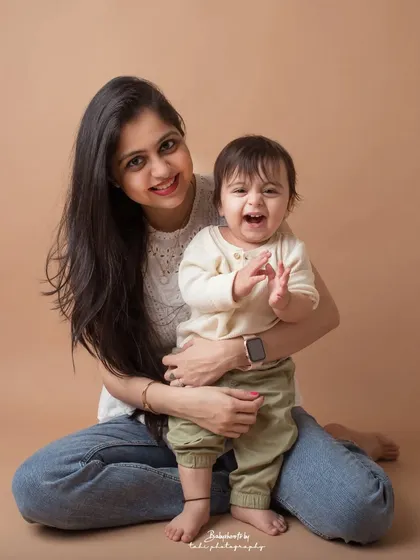 A mother and son share a beautiful, genuine laugh. These are the candid moments that tell the real story of a family.