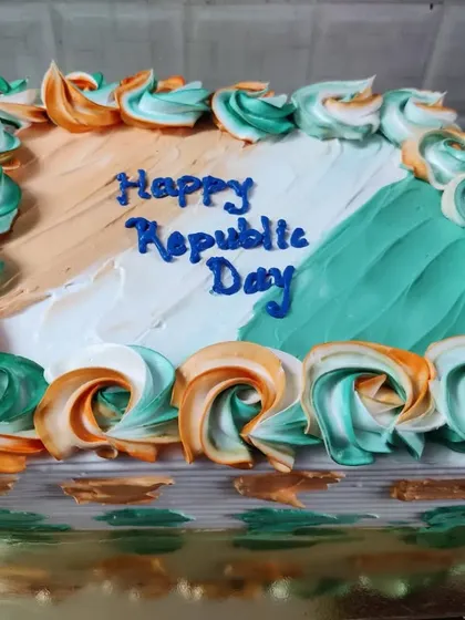 A rectangular cake decorated for Republic Day with the colors of the Indian flag in a beautiful rosette pattern.
