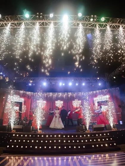 A stage fit for a show-stopping performance. I designed this multi-level stage with a massive lighting rig and cold-pyro effects to create a high-energy, concert-like feel for the Sangeet night.