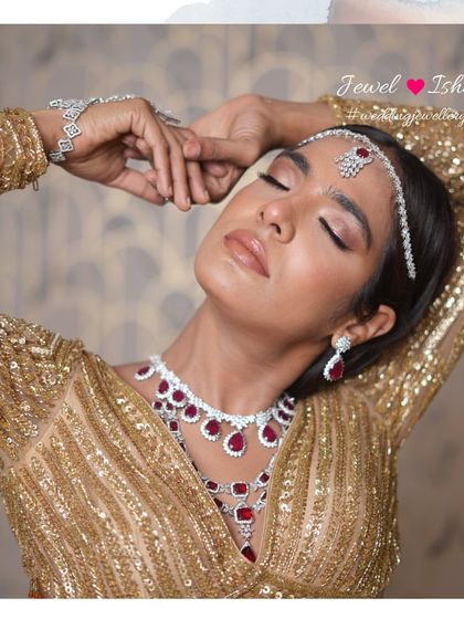 Lost in the moment, adorned in sparkle. The way the light catches this ruby and diamond set is just magical. It’s perfect for the bride who wants to feel like a movie star on her special day.