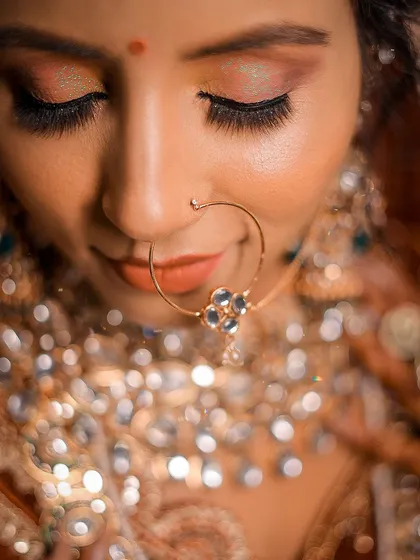 An artistic close-up focusing on the nose ring, with the background jewelry creating a beautiful bokeh effect. Shot on my Canon R6.