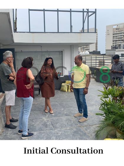 Our process always starts with an initial on-site consultation. Here I am with my team and clients, discussing the vision and possibilities for a new rooftop landscaping project.