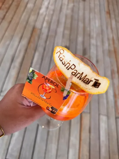 This is an example of how I align my creations with a high-fashion theme. For a Hermès-inspired sundowner, I crafted this vibrant Aperol cocktail, complete with a custom-branded garnish that perfectly matched the event's luxurious and stylish atmosphere.