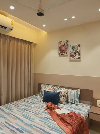A full view of the bedroom, showcasing its clean and functional design.