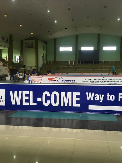 The welcome banner at the international championship. This represents a significant step for our academy and its fighters.