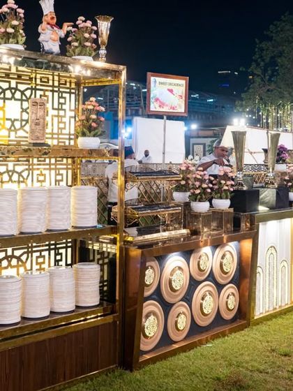 Indulge in the finest cuisine with our elaborate and stylish buffet counters. The combination of wood, metal, and ambient lighting creates a sophisticated backdrop for our culinary creations.