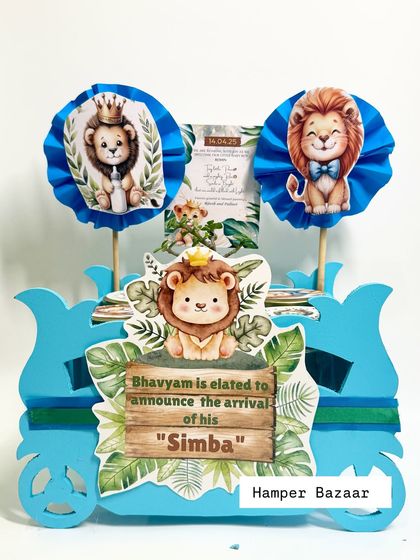 Roar! A jungle-themed hamper to announce the arrival of baby "Simba." This was created in a custom jeep-shaped box.