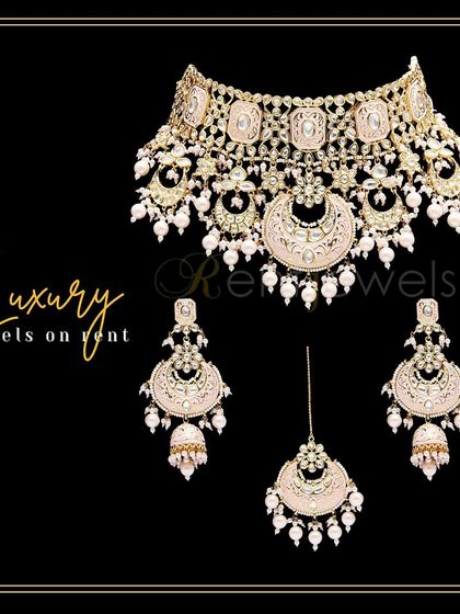 A beautiful pink Meena work choker set with delicate detailing. This statement-making piece is perfect for adding a touch of royal Rajasthani charm to your look.